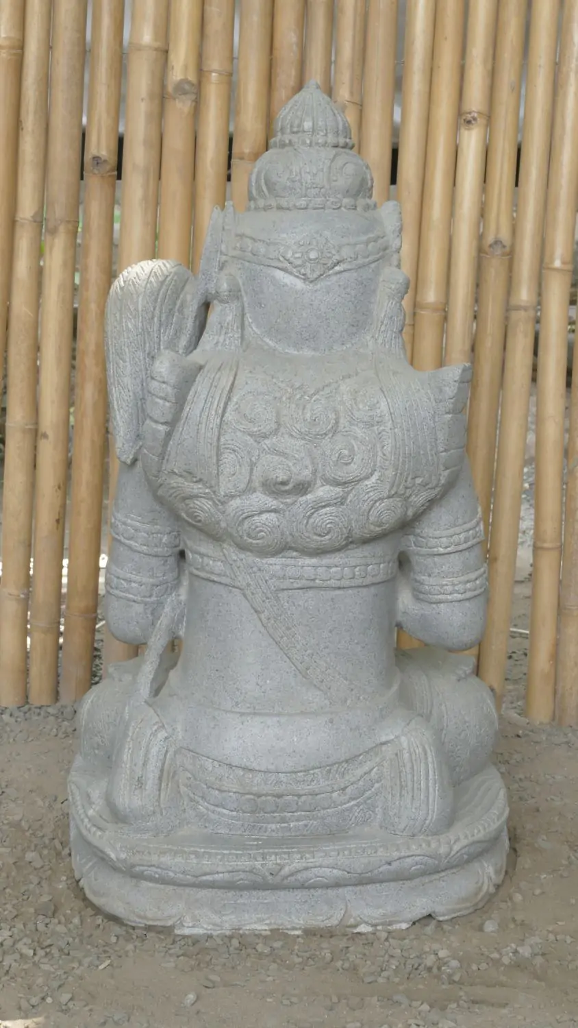  Product image 8 of the product “Seated Dewi Sri, position chakra turning the wheel, 73cm high riverstone grey, model with sativa. There is a stone eye on the left temple. ”